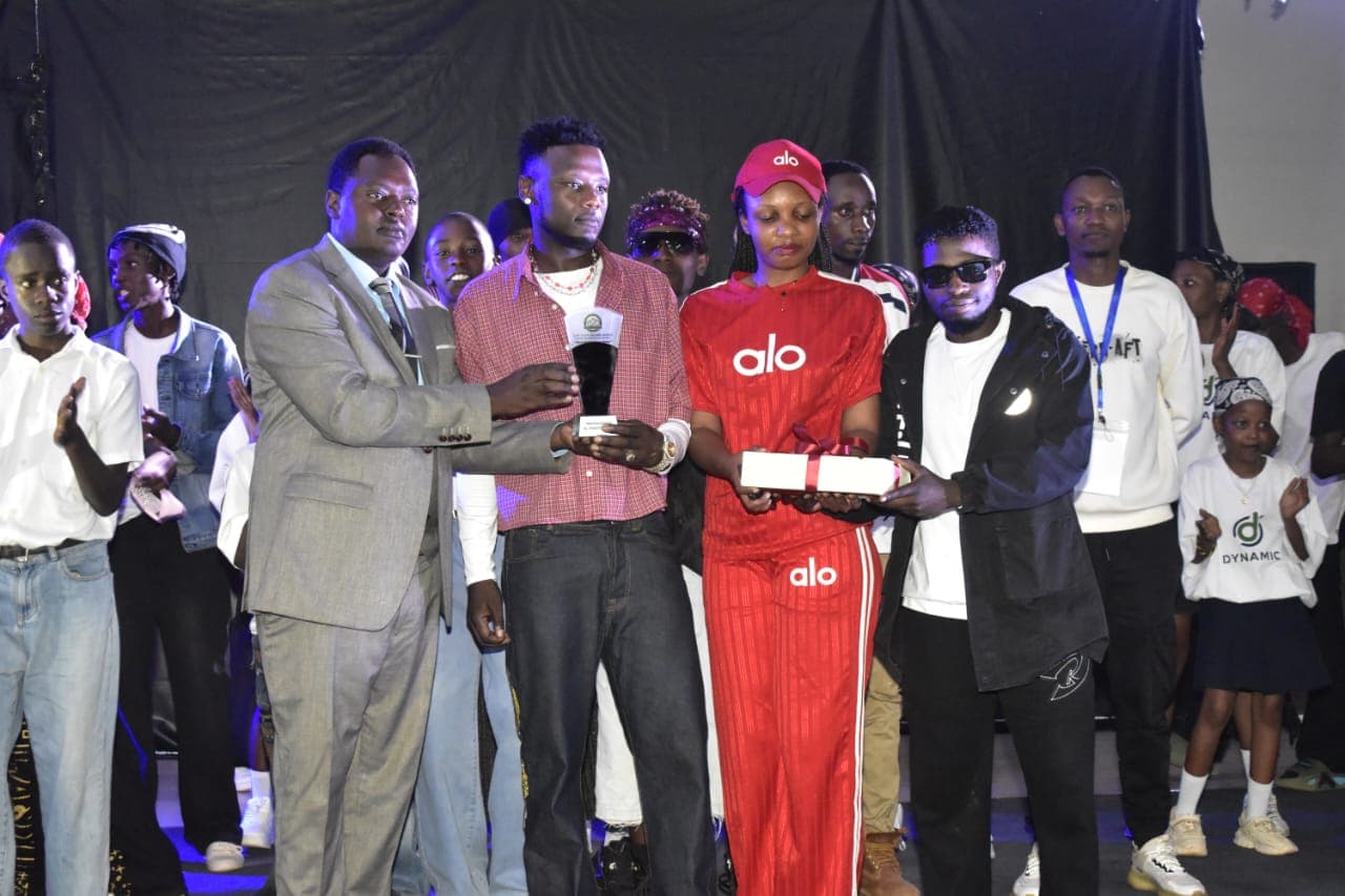 RFM leadership presenting youth music recognition awards and legal certificate on stage